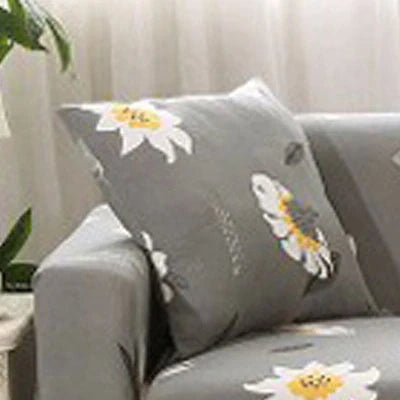 Stretchable geometric print sofa cover on a three-seater sofa