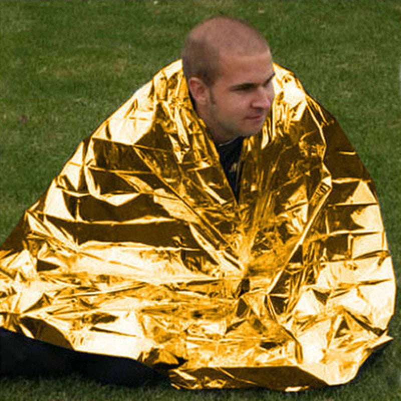 Silver aluminised emergency blanket for outdoor survival and hypothermia prevention