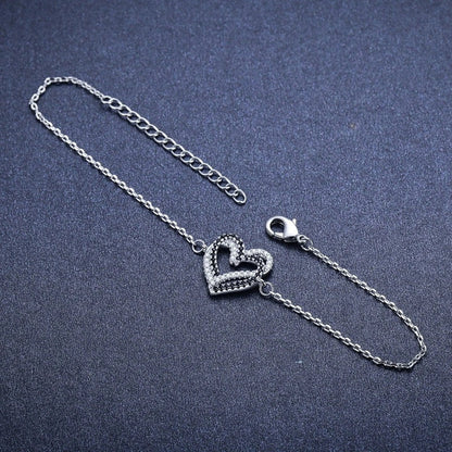 Elegant Titanium Steel Heart Bracelet for women, featuring a delicate heart design.