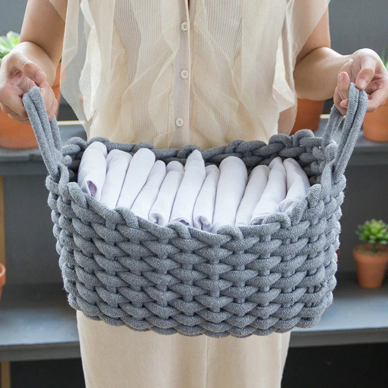 Hand-woven cotton rope storage basket in grey and white colours, featuring a minimalist nordic design for practical and stylish home organisation
