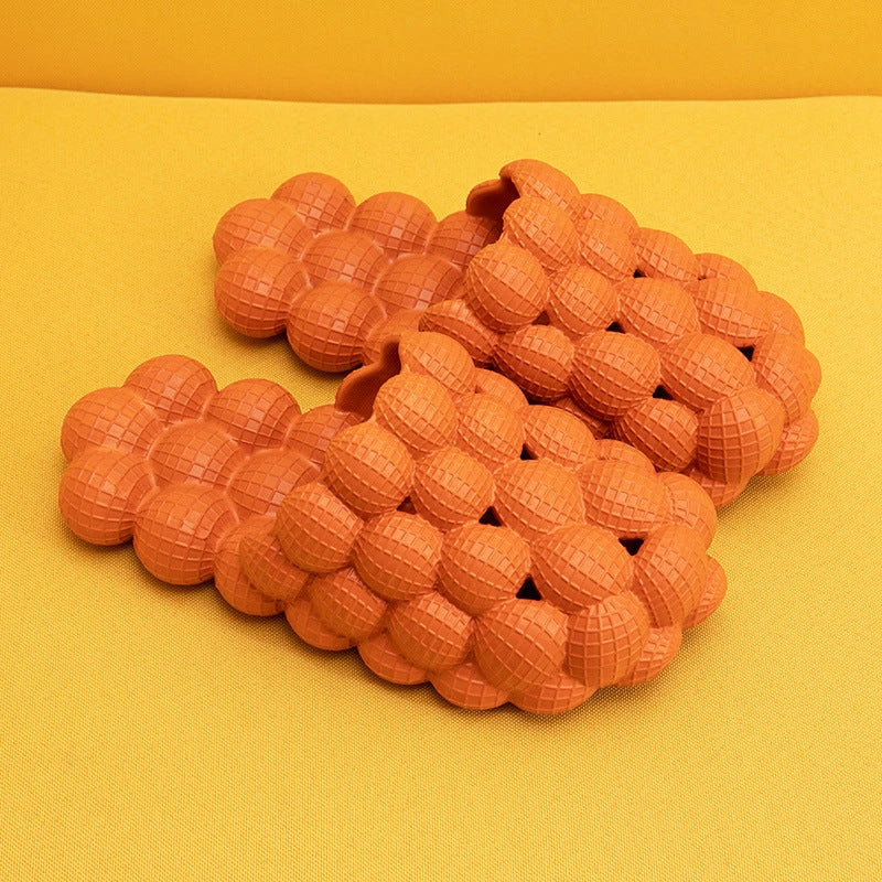 Comfortable massage bubble slides with breathable mesh upper and non-slip soles for indoor relaxation and pampering