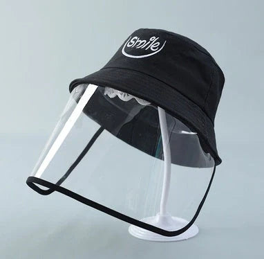 Child wearing anti-spitting protective hat with transparent bezel