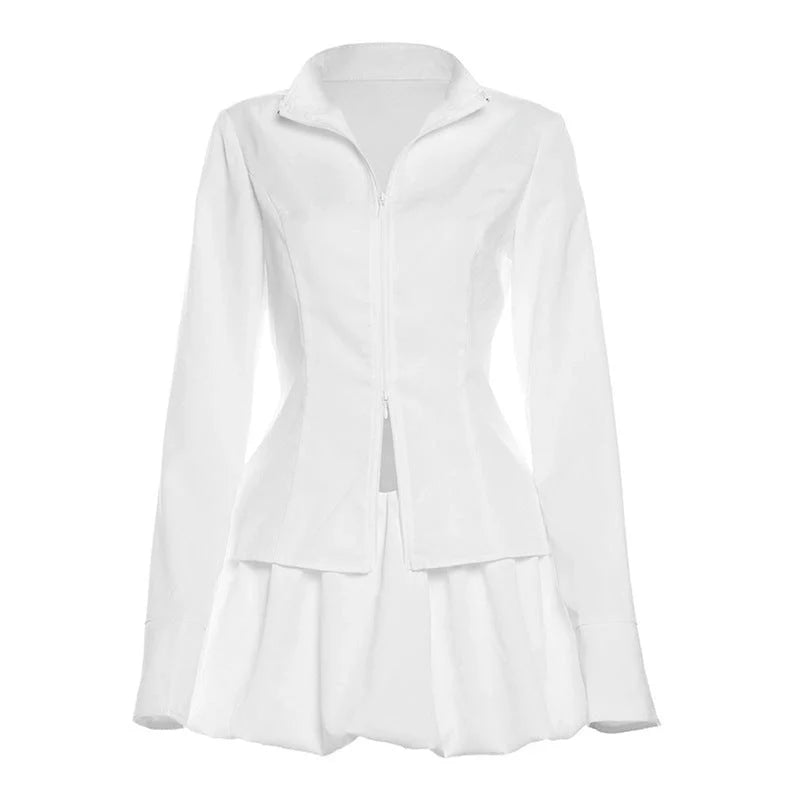 Fashionable two-piece set featuring a tailored top with V-neck and long sleeves, and a chic mini skirt. Available in white and black colours.