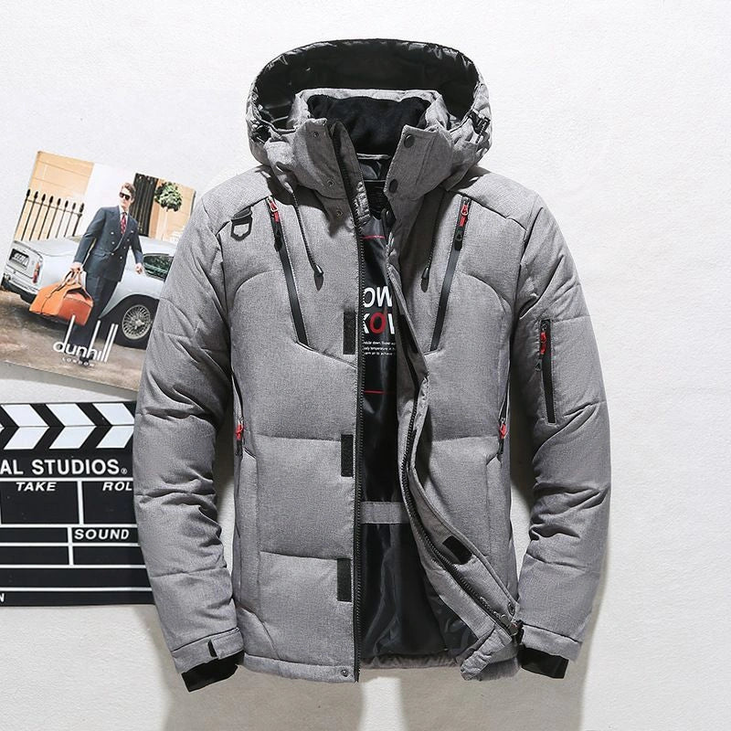 A cosy, hooded windbreaker jacket in a variety of classic colours, designed for outdoor adventures in the United Kingdom.