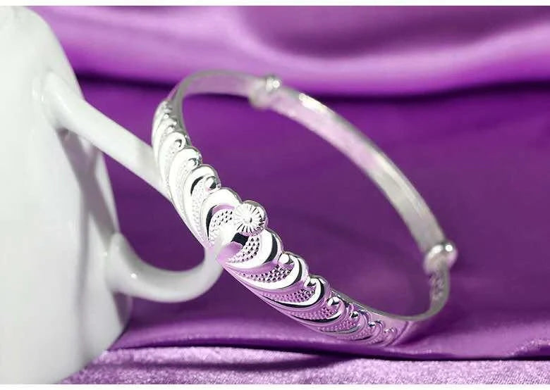 Women's silver electroplated crown bracelet with detailed design