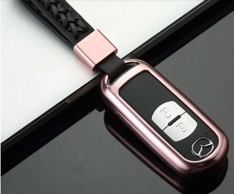 Aluminium alloy key case for Mazda with CNC engraving in sapphire, blue, grey, and rose gold