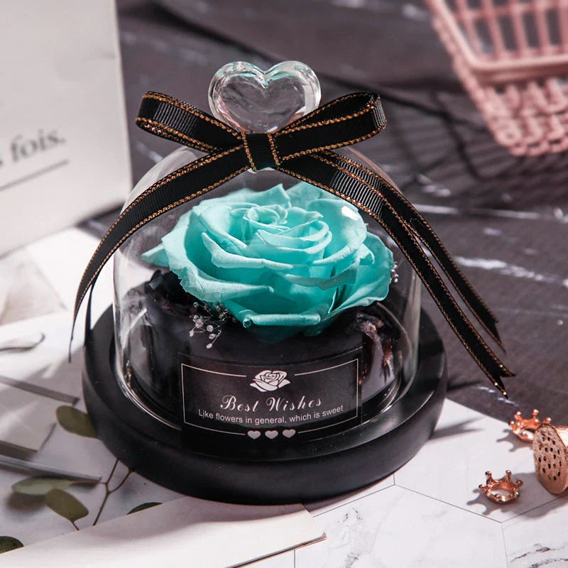 Enchanting Eternal Rose with LED lighting in a glass display, showcasing its timeless beauty and elegant design