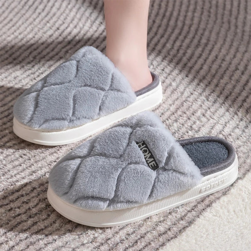 Plush slippers with soft, cushiony upper and durable PVC sole for cozy indoor comfort and traction