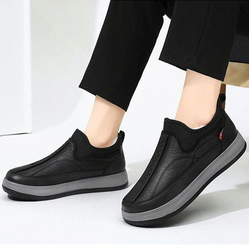 Cozy winter snow boots with round-toe design, non-slip platform, and warm fleece lining in black and grey colors