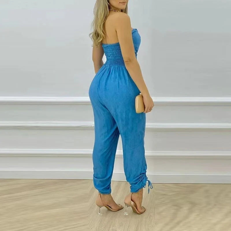 Women's sleeveless denim jumpsuit with tube top design in classic blue