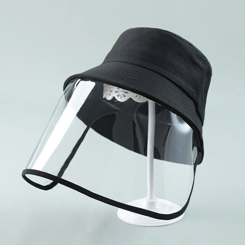 Child wearing anti-spitting protective hat with transparent bezel