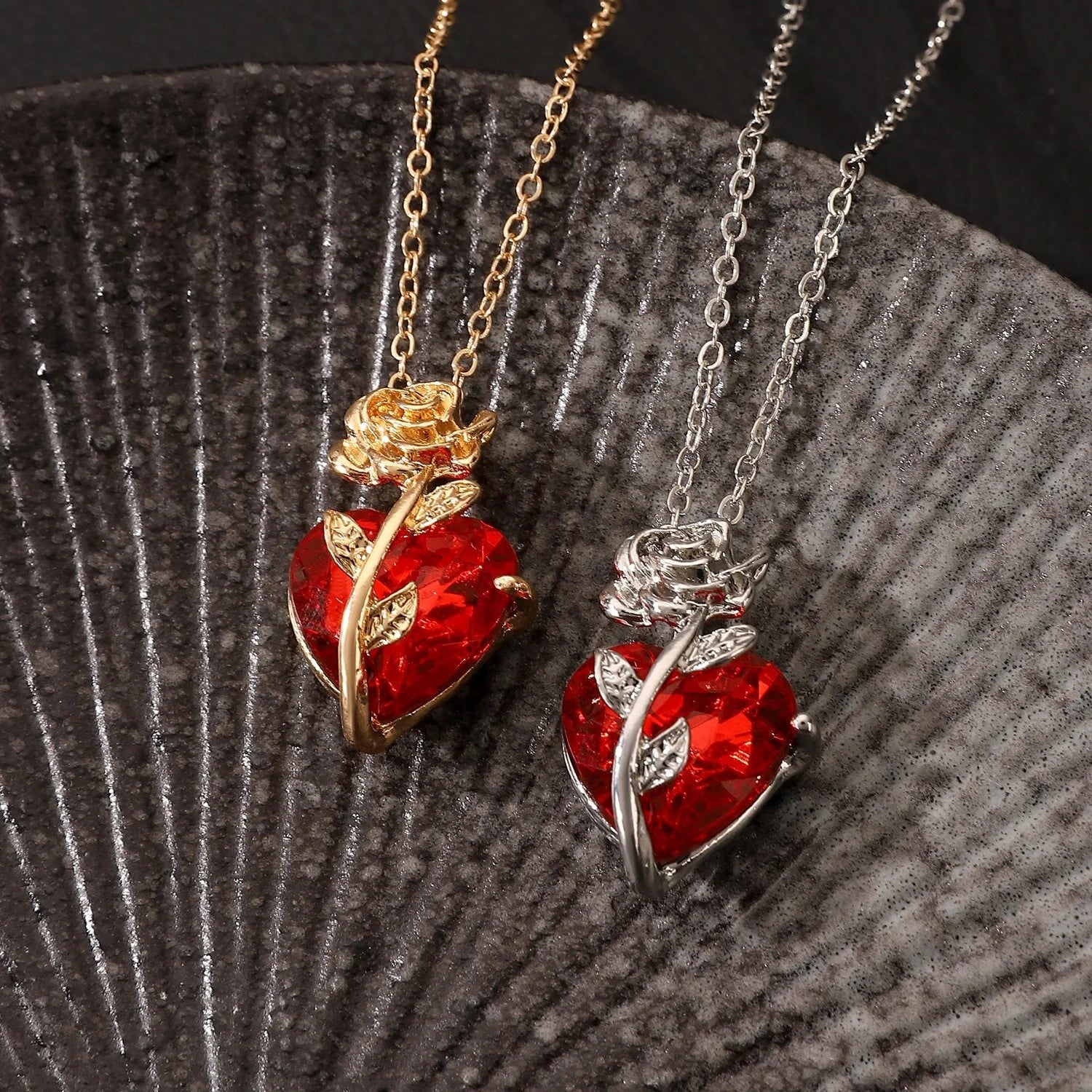 Punk Rose Love Necklace with heart-shaped clavicle chain pendant in black, gold, and silver.