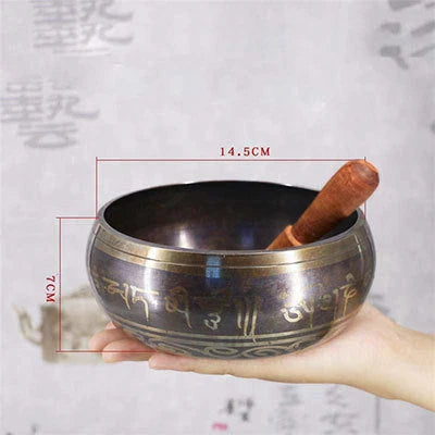 A handcrafted Tibetan singing bowl made of copper, used for meditation and relaxation.