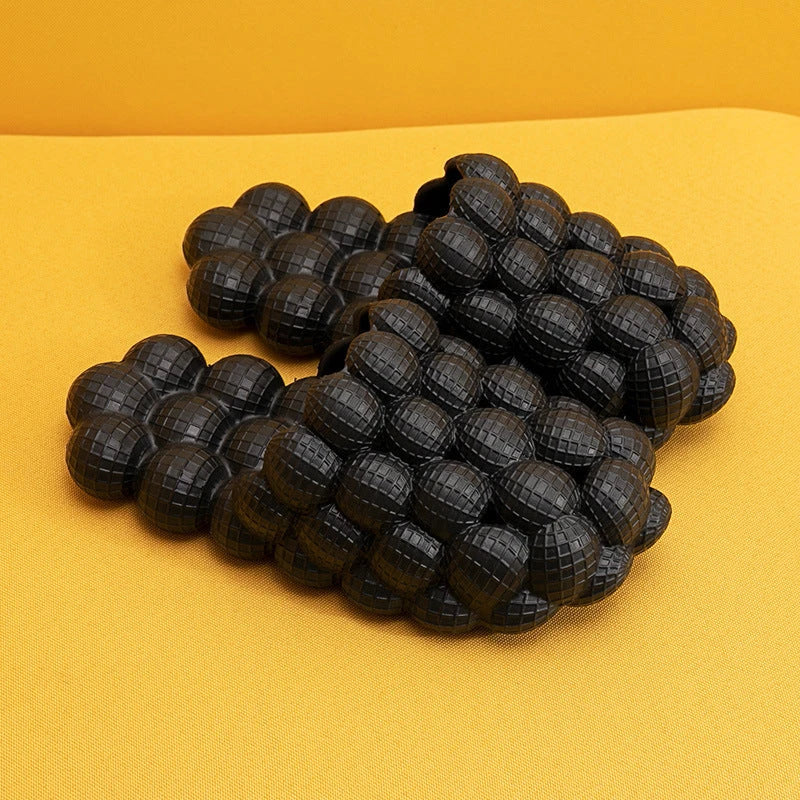 Comfortable massage bubble slides with breathable mesh upper and non-slip soles for indoor relaxation and pampering