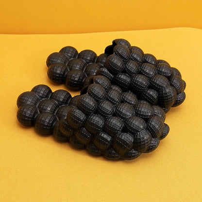 Comfortable massage bubble slides with breathable mesh upper and non-slip soles for indoor relaxation and pampering