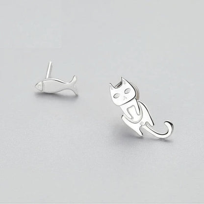 Elegant asymmetric 925 sterling silver stud earrings with cat and fish motifs, a modern and sophisticated accessory