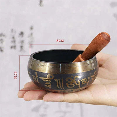 A handcrafted Tibetan singing bowl made of copper, used for meditation and relaxation.