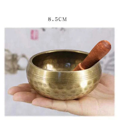 A handcrafted Tibetan singing bowl made of copper, used for meditation and relaxation.
