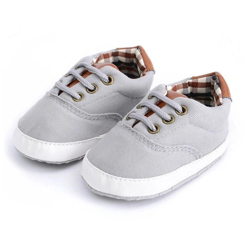 Solid colour baby canvas shoes with soft bottom and front strap in sizes 11cm to 13cm