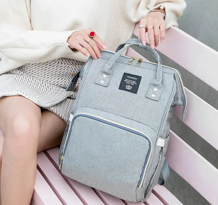 Premium mummy backpack in a range of stylish colours, featuring dedicated compartments for bottles, nappies and personal items.