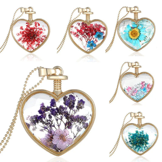 Elegant glass-encased dried flower pendant necklace with bead chain, showcasing a variety of preserved floral arrangements.