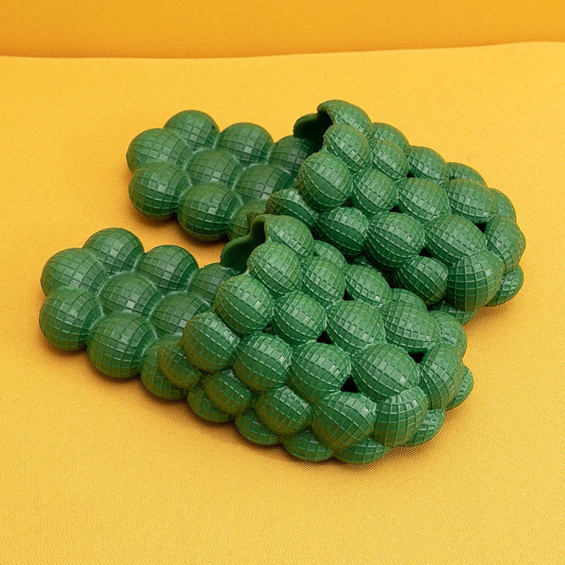 Comfortable massage bubble slides with breathable mesh upper and non-slip soles for indoor relaxation and pampering