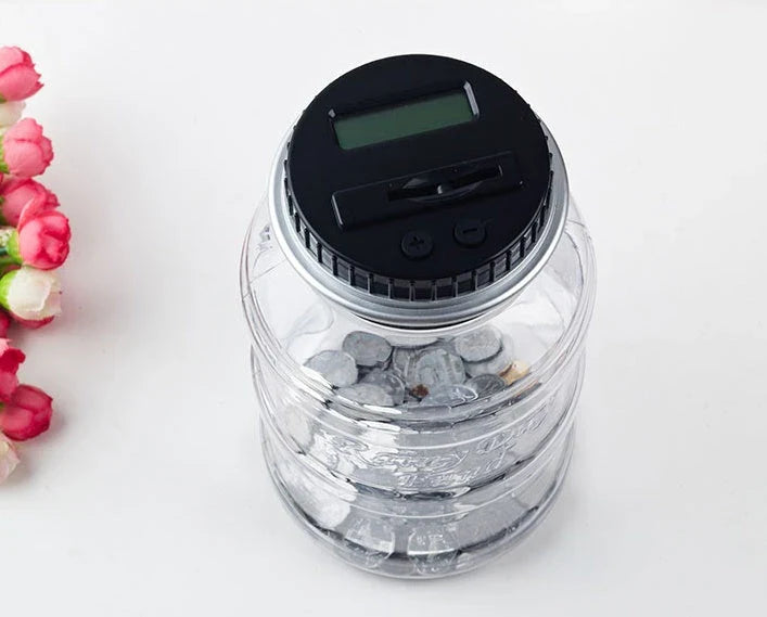 Transparent digital money box with LCD coin counter, designed for effortless coin saving and tracking in the UK