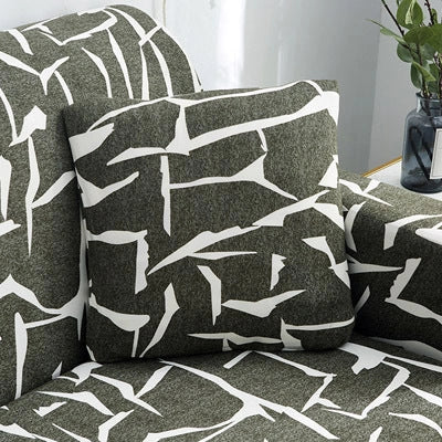 Stretchable geometric print sofa cover on a three-seater sofa