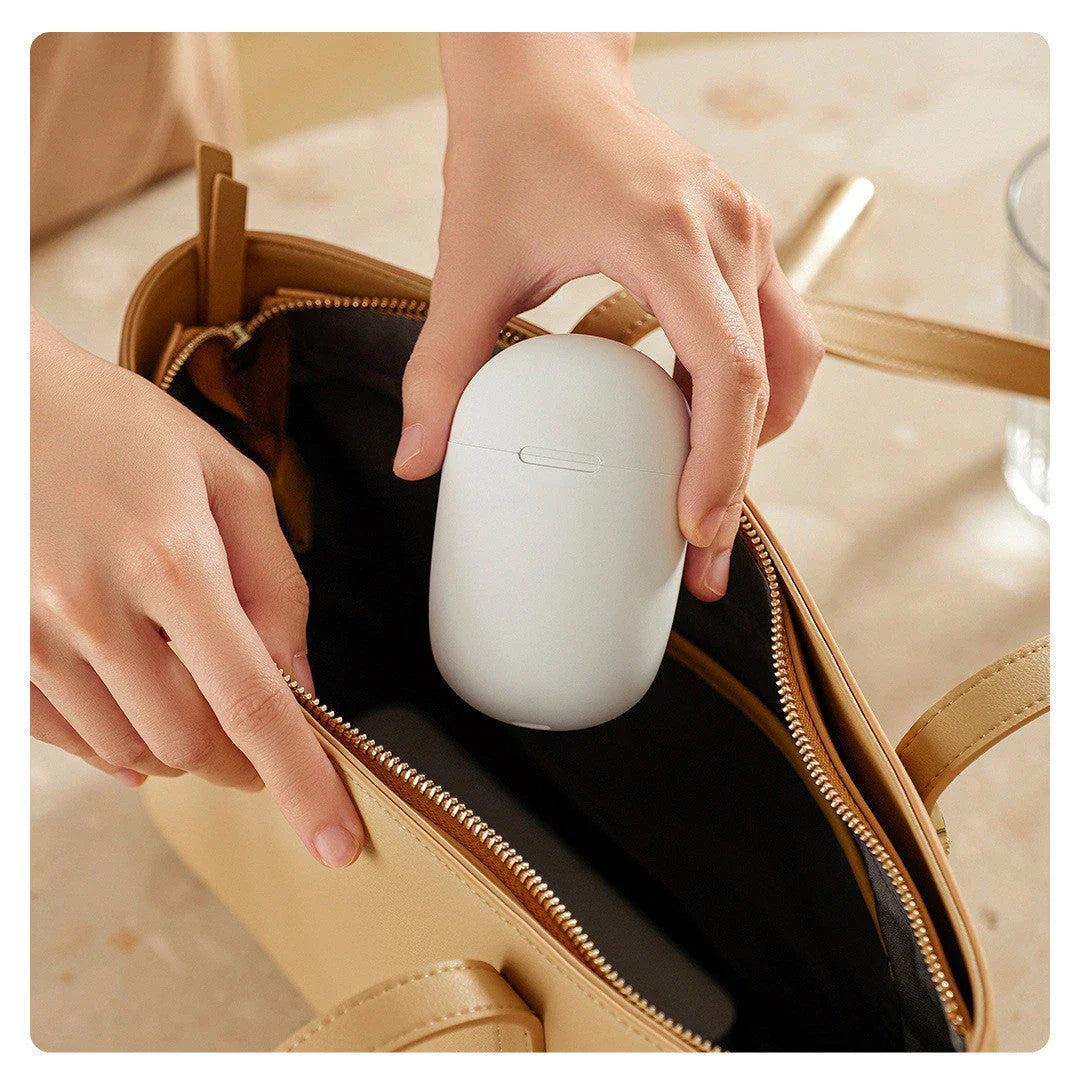 Compact Pocket Massager with low-frequency pulse technology for neck, back, and shoulder massage relief