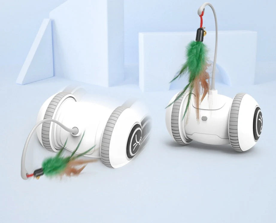 Interactive robotic cat toy with interchangeable feather and plush chick heads