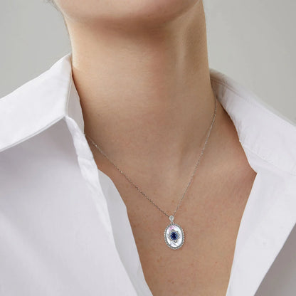 Elegant sterling silver pendant necklace with sparkling sapphires and diamonds, perfect for fashion-forward women