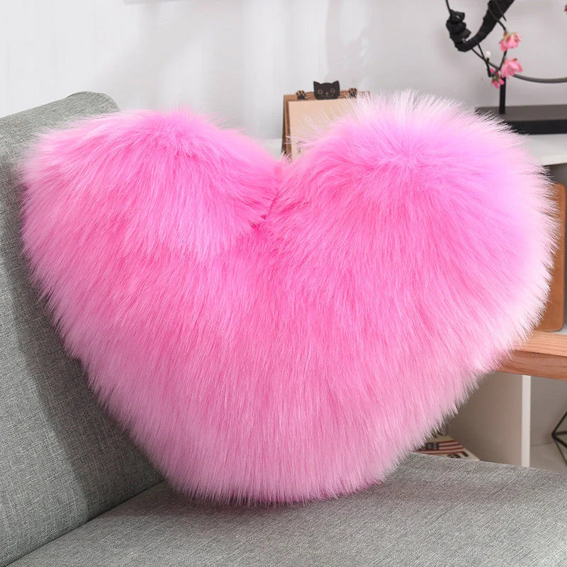 Cozy heart-shaped throw pillow with plush, shaggy texture in various colors
