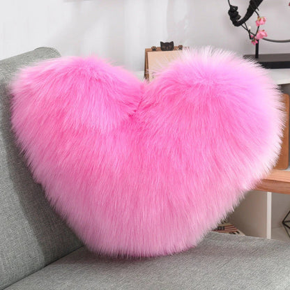 Cozy heart-shaped throw pillow with plush, shaggy texture in various colors