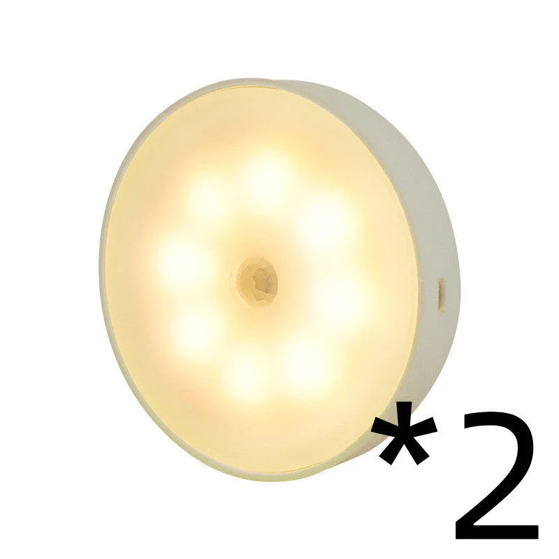 Motion-activated LED puck lights in warm and white color options, with various pack sizes and USB recharging