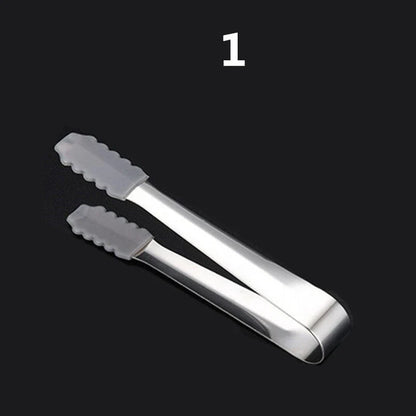 Premium stainless steel whisky chilling stones set in various shapes and sizes, including square, circular, heart, and diamond-shaped stones