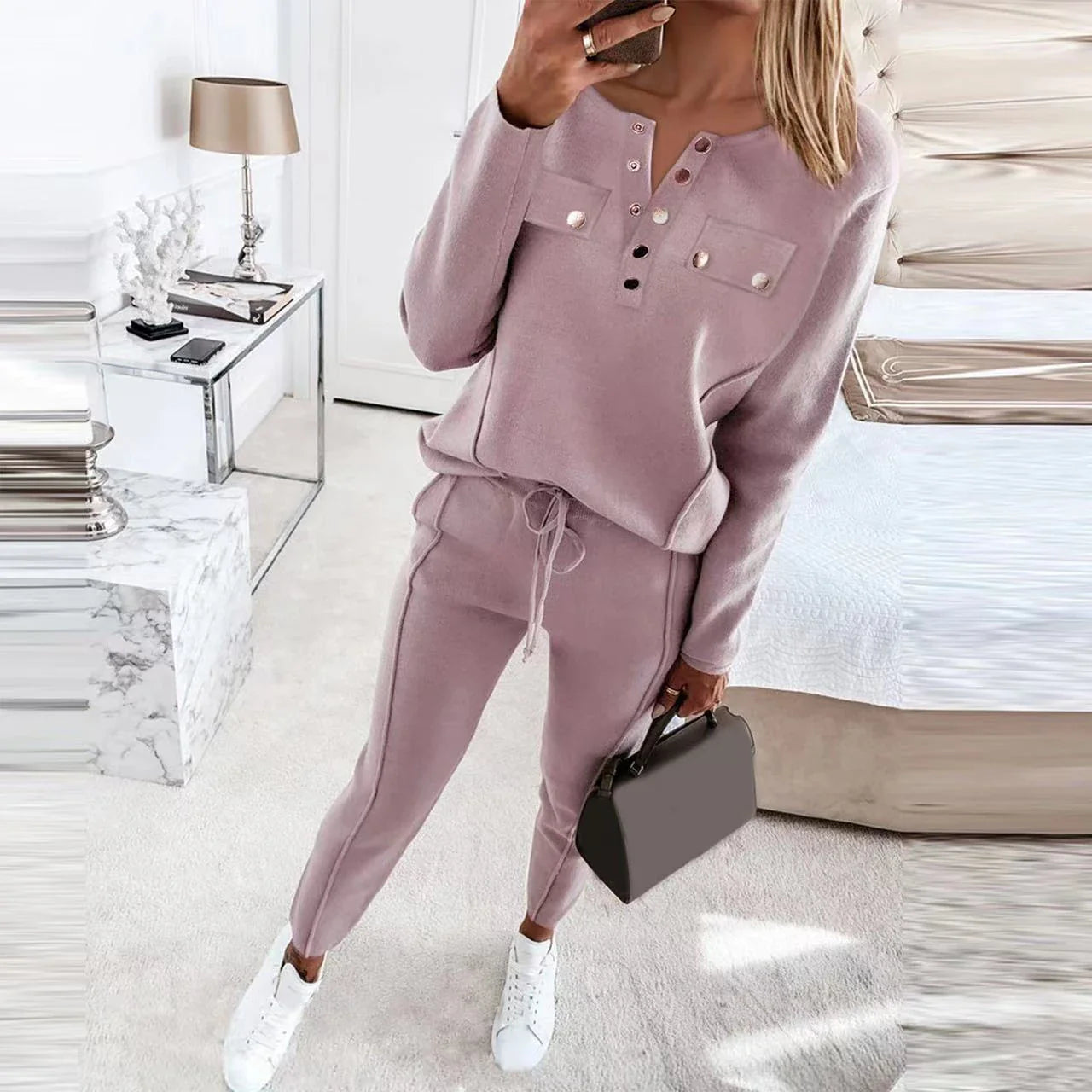 Cozy two-piece lounge set in soft cotton-blend fabric with crew-neck sweatshirt top and high-waisted drawstring pants
