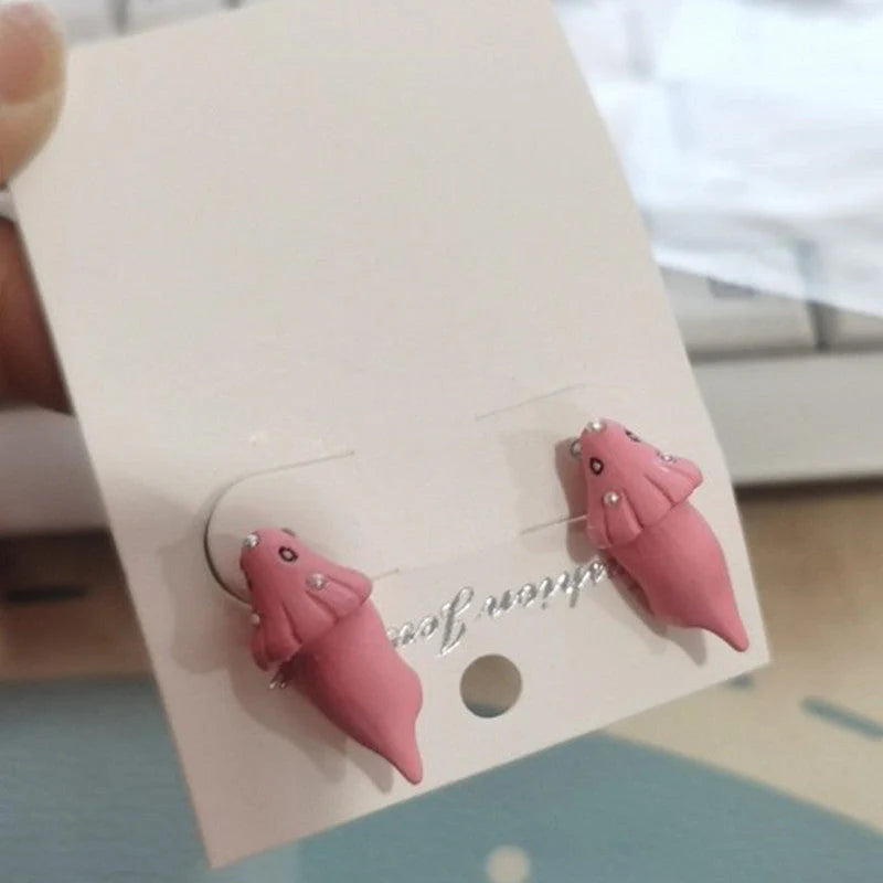 Playful animal bite earrings featuring dinosaur and whale designs, perfect for adding a quirky touch to your style.