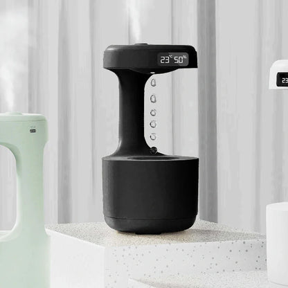 Anti-gravity humidifier with LED display and aroma diffuser in white, green, and black