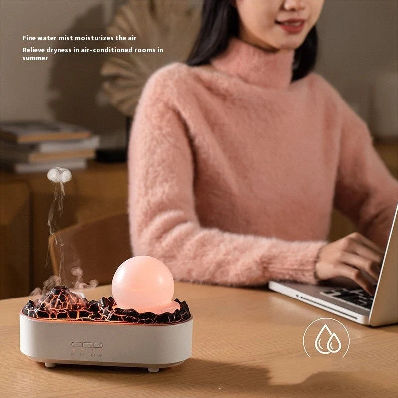 USB Volcano Humidifier on a desktop, emitting a heavy fog for air moisture