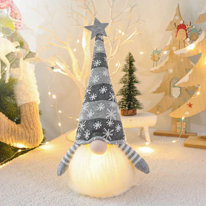 Festive faceless gnome figures in various colours, including green, red, and grey, adding a whimsical touch to Christmas home decor