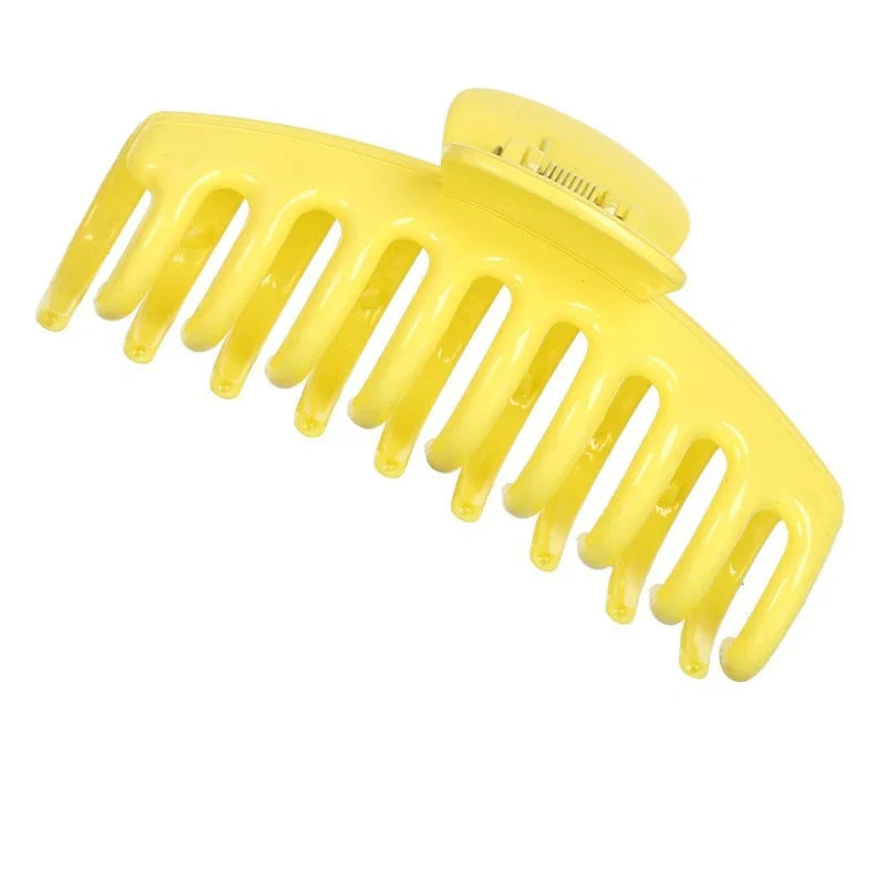 Candy-coloured plastic ponytail clip for showers and daily hair styling