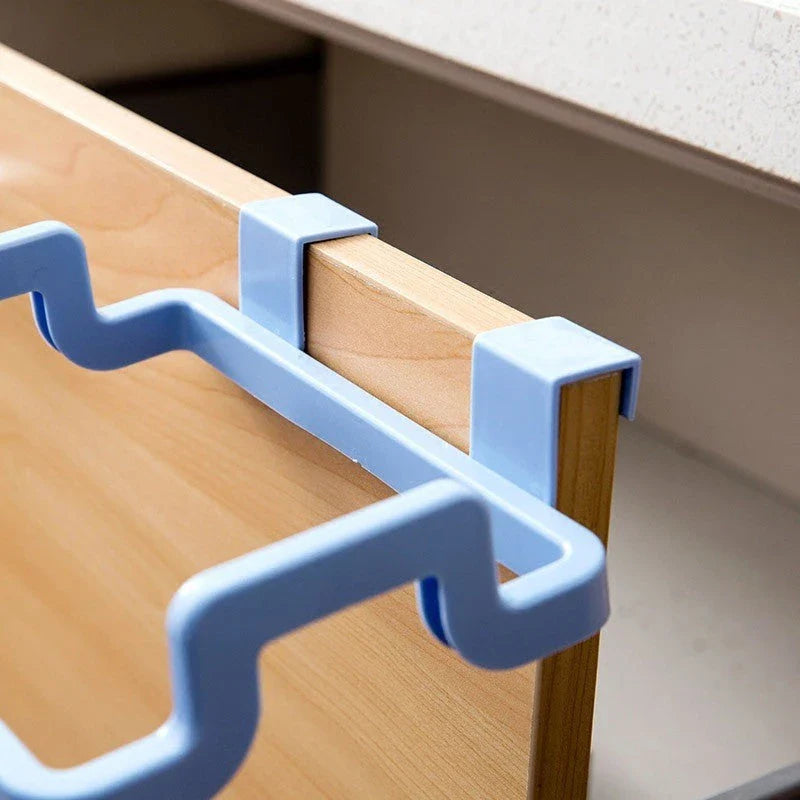 Versatile kitchen storage caddy that hangs discreetly behind cabinet doors, available in a variety of vibrant colours