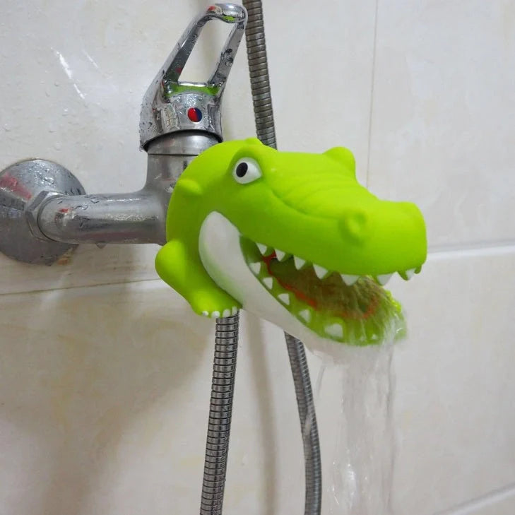 Child using silicone faucet extender for hand washing in grey shark design