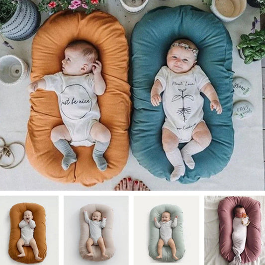 Portable baby nest crib with cotton cover for newborns, dimensions 75cm by 45cm