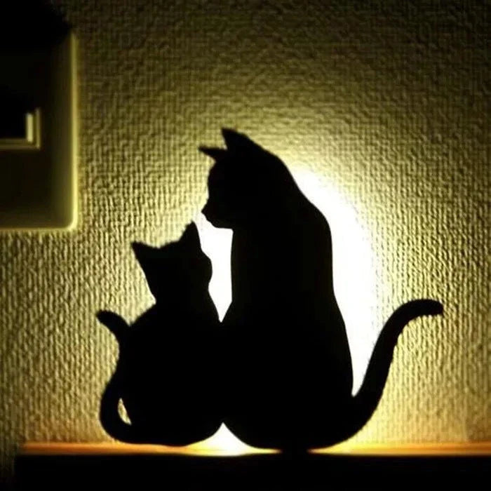 A stylish cat-shaped smart sensor night light that automatically illuminates a room when motion is detected, creating a warm and cozy atmosphere.