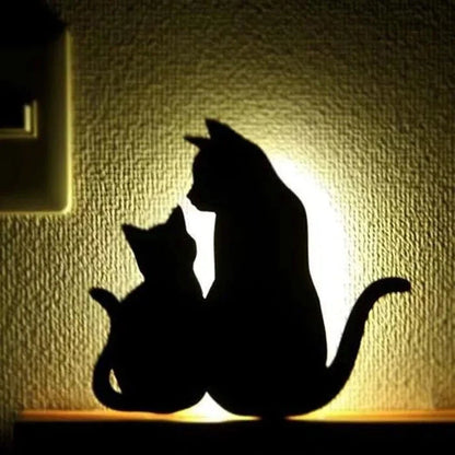 A stylish cat-shaped smart sensor night light that automatically illuminates a room when motion is detected, creating a warm and cozy atmosphere.