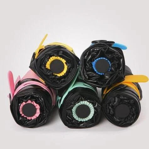 Compact folding umbrella in multiple colours, offering sun protection and windproof design for all-weather use in the UK