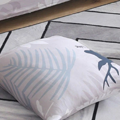 Stretchable geometric print sofa cover on a three-seater sofa