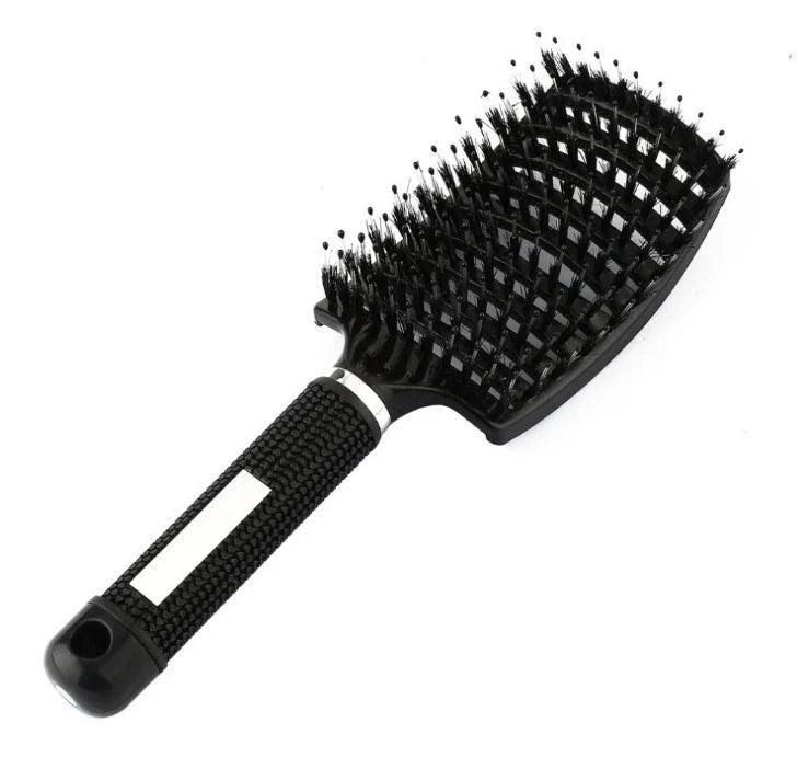 A premium hair brush with a sleek design, featuring soft bristles and a rounded massage function for healthy, detangled hair