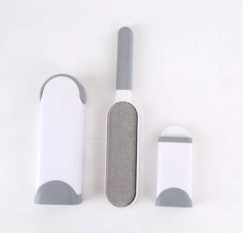 A reusable pet hair remover comb with a self-cleaning base, perfect for removing fur and lint from sofas, chairs, and other upholstery.